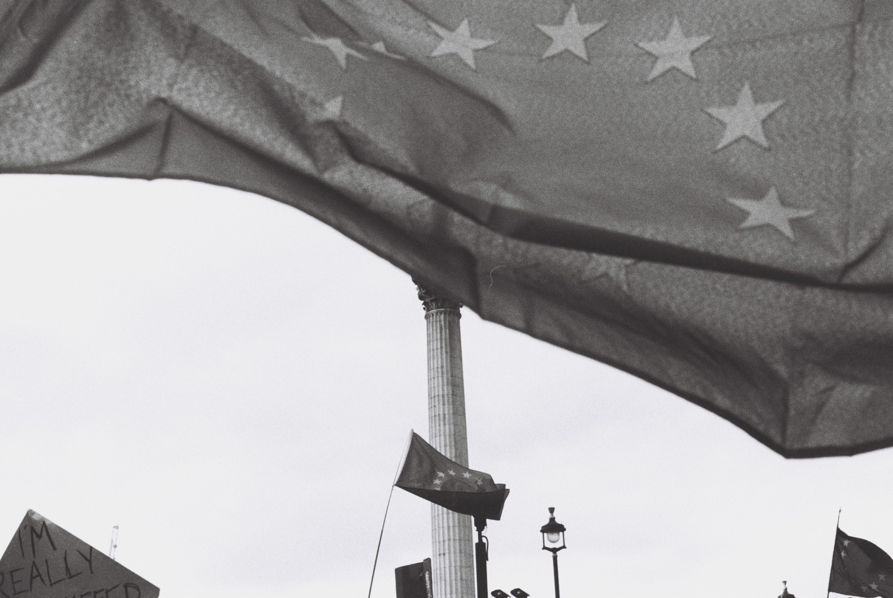 Nelson's colum statue hidden behind an EU flag